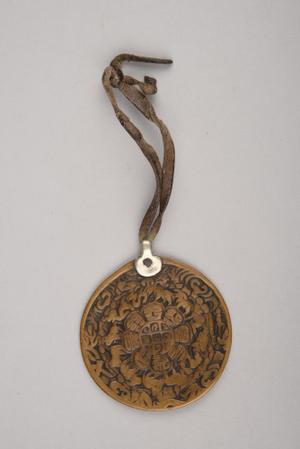 140848, round cast brass amulet