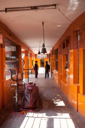 Hallway with bells and trisuls (trident) in Pindeshwor temple