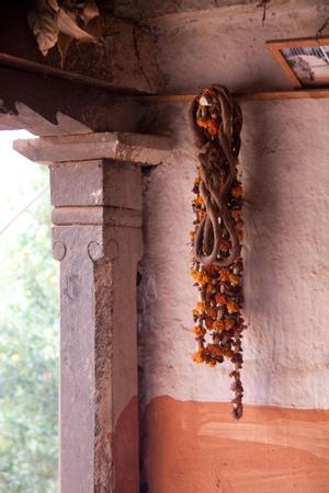 'Handula' and flower chains hanging in front of a house
