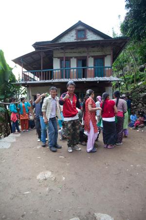Villagers dancing sakela in the courtyard of a house after the rituals at the bhume or sakela than