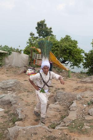 The ritual specialist in charge of the bhume ritual at Tuwachung-Jayajum festival arrives at the festival ground