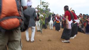 Dumi Rai dance group from Rudalung village performing sakela sili dance steps at Tuwachung-Jayajum festival with watching crowd in the background