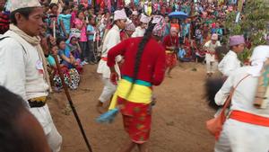Chamling Rai dance group from Khatamcha village performing sakela sili dance steps at Tuwachung-Jayajum festival with watching crowd in the background