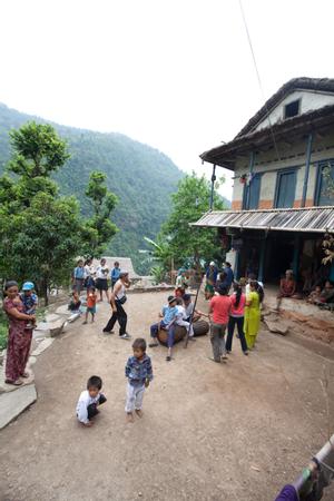 Villagers dancing sakela in the courtyard