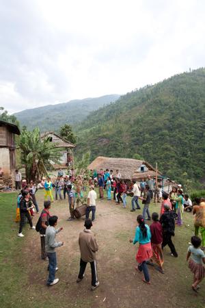 Villagers dancing sakela in the school yard after the rituals at the bhume or sakela than