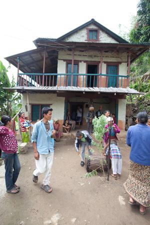 Villagers dancing in the courtyard during sakea puja