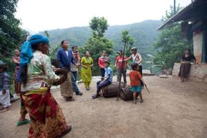 Villagers dancing sakela in the courtyard