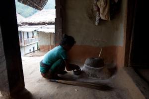 Woman grinding flour
