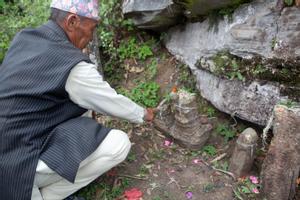 Bishnu Bahadur Chamling explaining the reijakhule stones near the place of worship for Khema