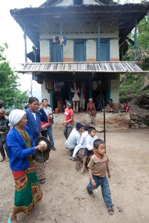 Villagers dancing in the courtyard during bhume or sakela puja