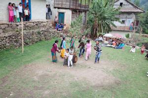 Villagers dancing sakela in the school yard after the rituals at the bhume or sakela than