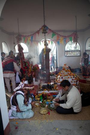 The official ritual specialist or shaman of the Kirat Rai Yayokkha with a participant during sakela puja