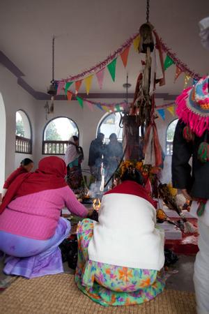 Participants placing offerings for the sakela puja at Hattiban temple