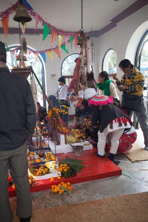 Participants placing offerings for the sakela puja at Hattiban temple